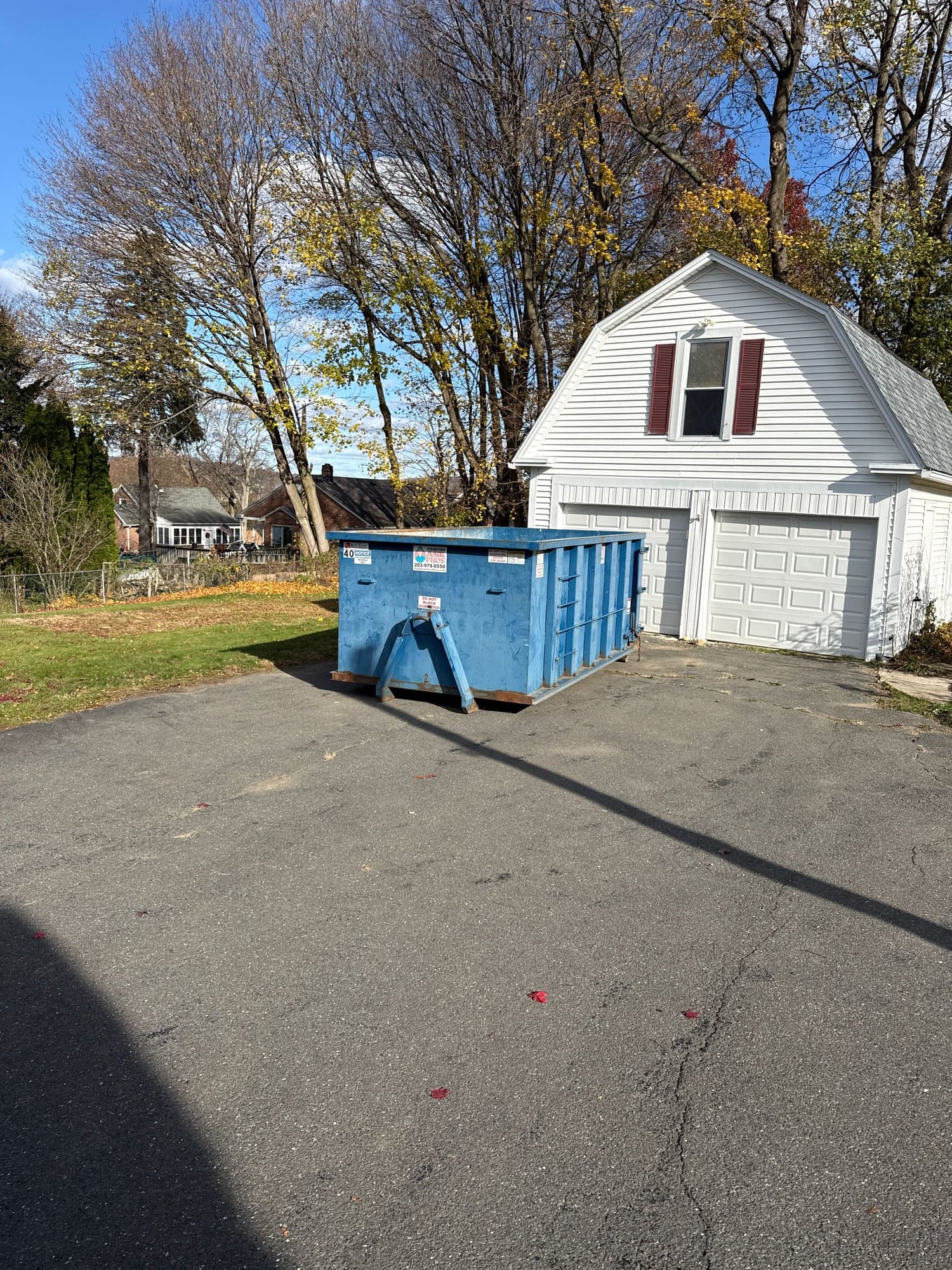 blue-dumpster-residential in Bristol, CT by Stamford Junk Pros