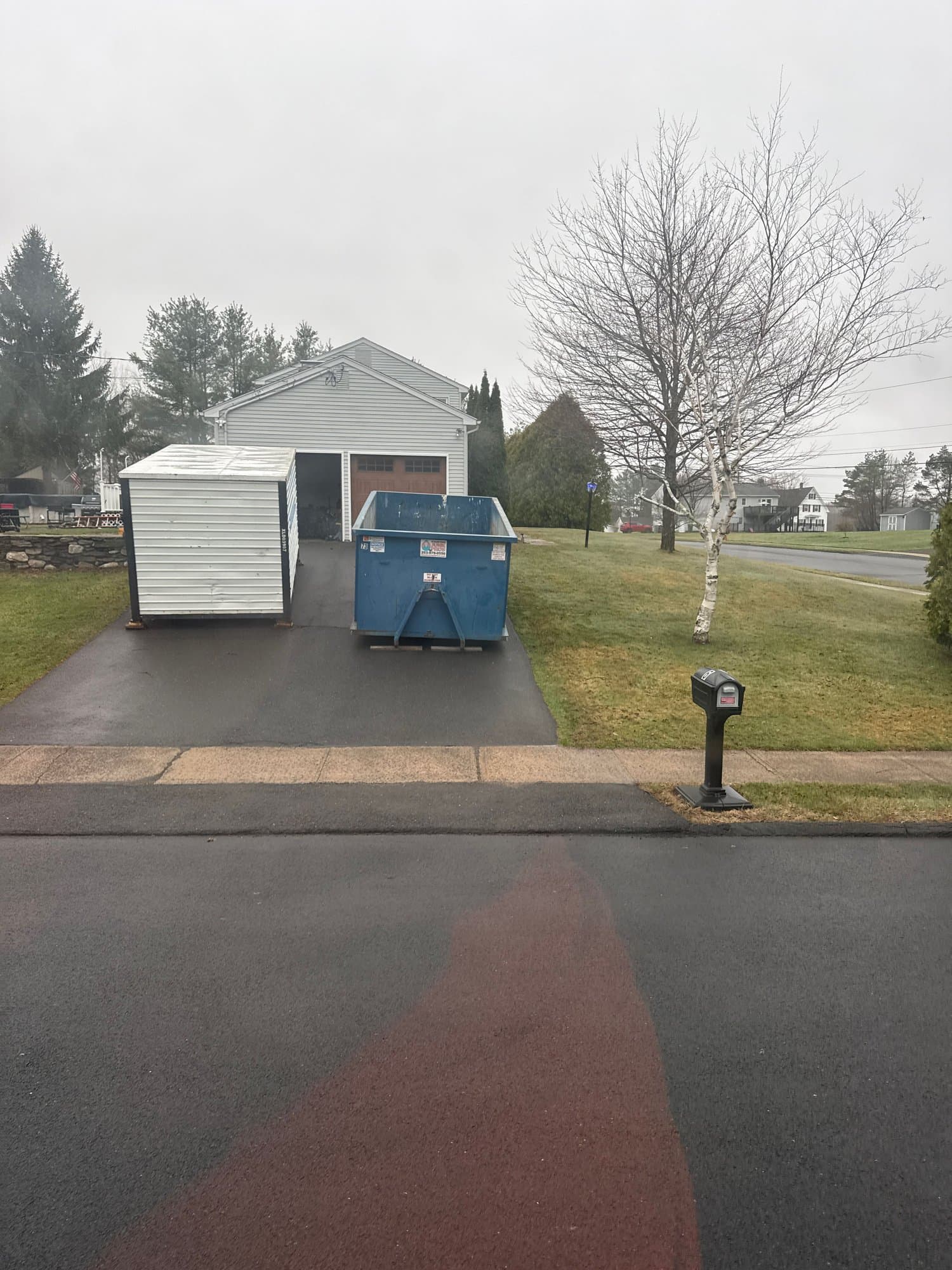 dumpster-at-home in Bristol, CT by Stamford Junk Pros