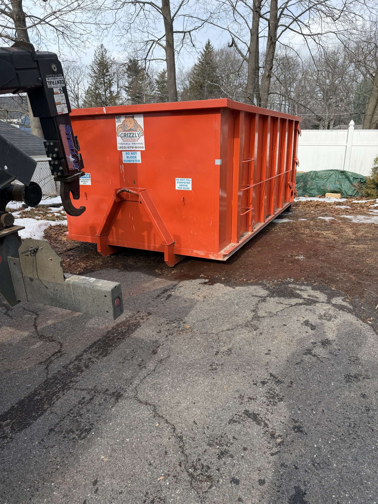 orange-dumpster-container in Bristol, CT by Stamford Junk Pros