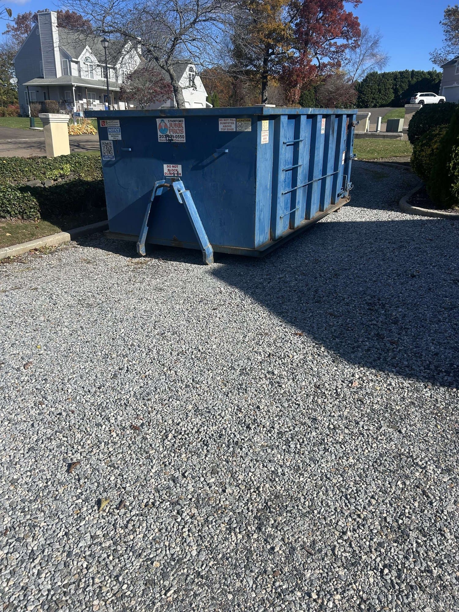 blue-dumpster-residential in East Haven, CT by Stamford Junk Pros