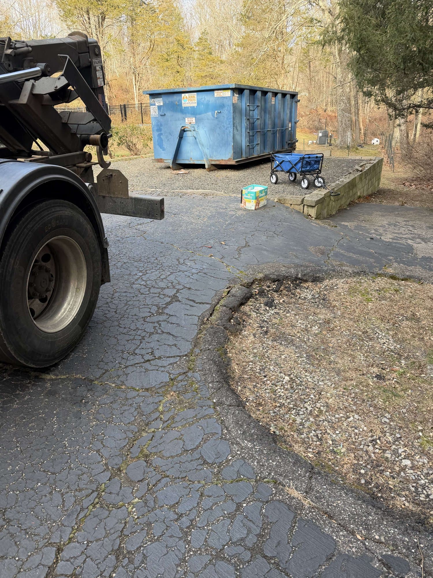 dumpster-drop-truck-setup in Fairfield, CT by Stamford Junk Pros