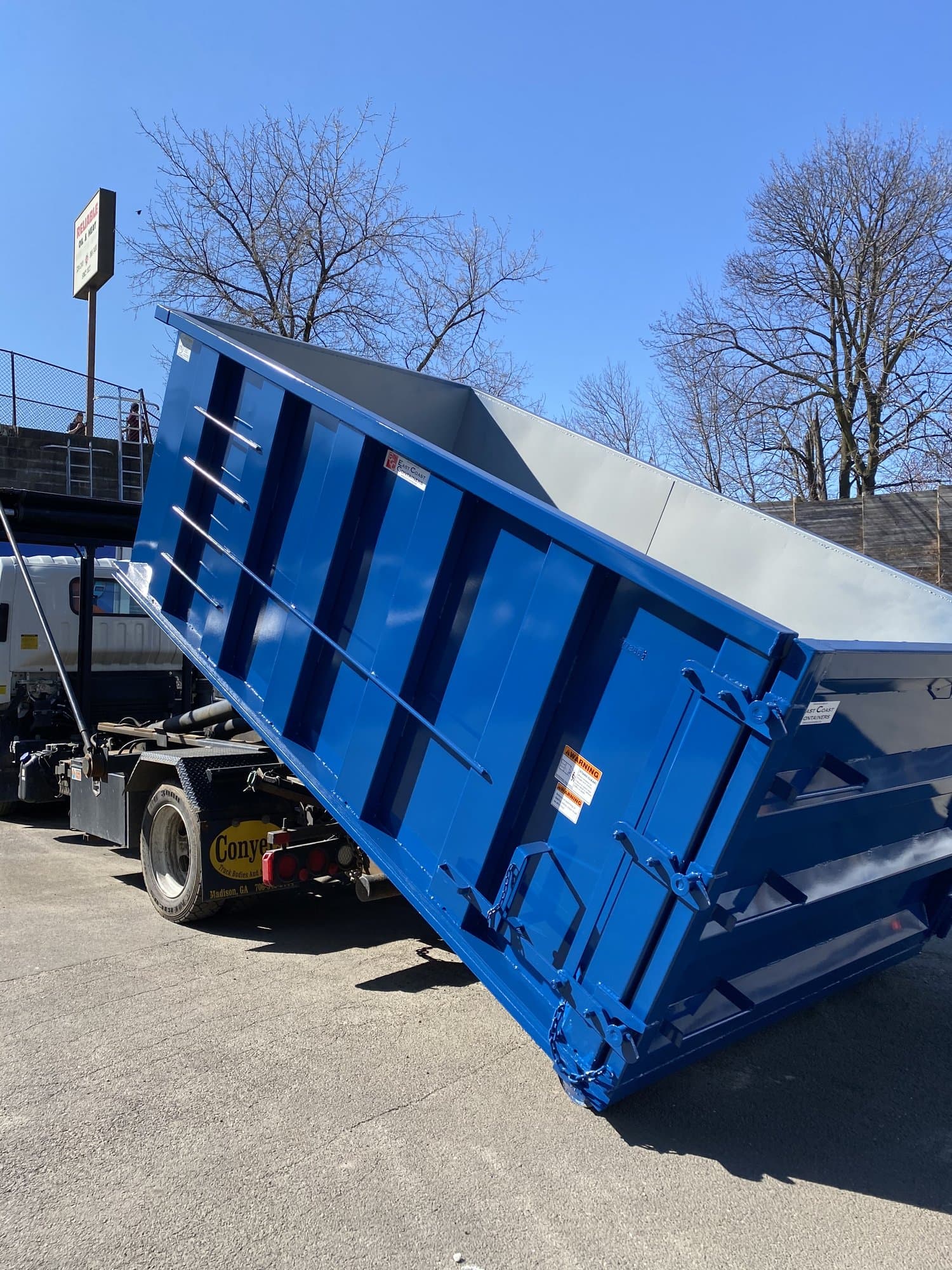 blue-dumpster-truck in Stamford, CT by Stamford Junk Pros