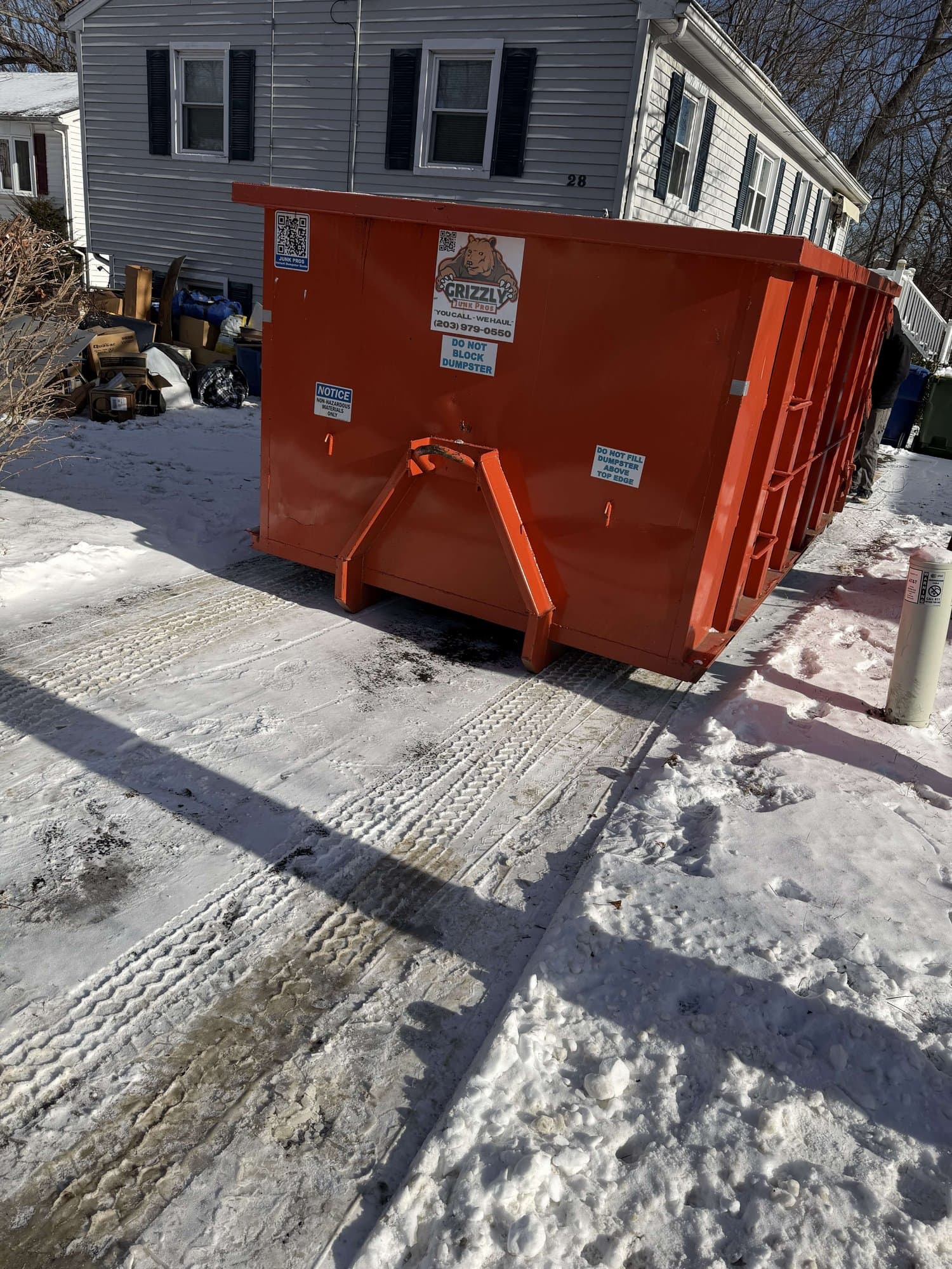 red-dumpster-residential in Waterbury, CT by Stamford Junk Pros