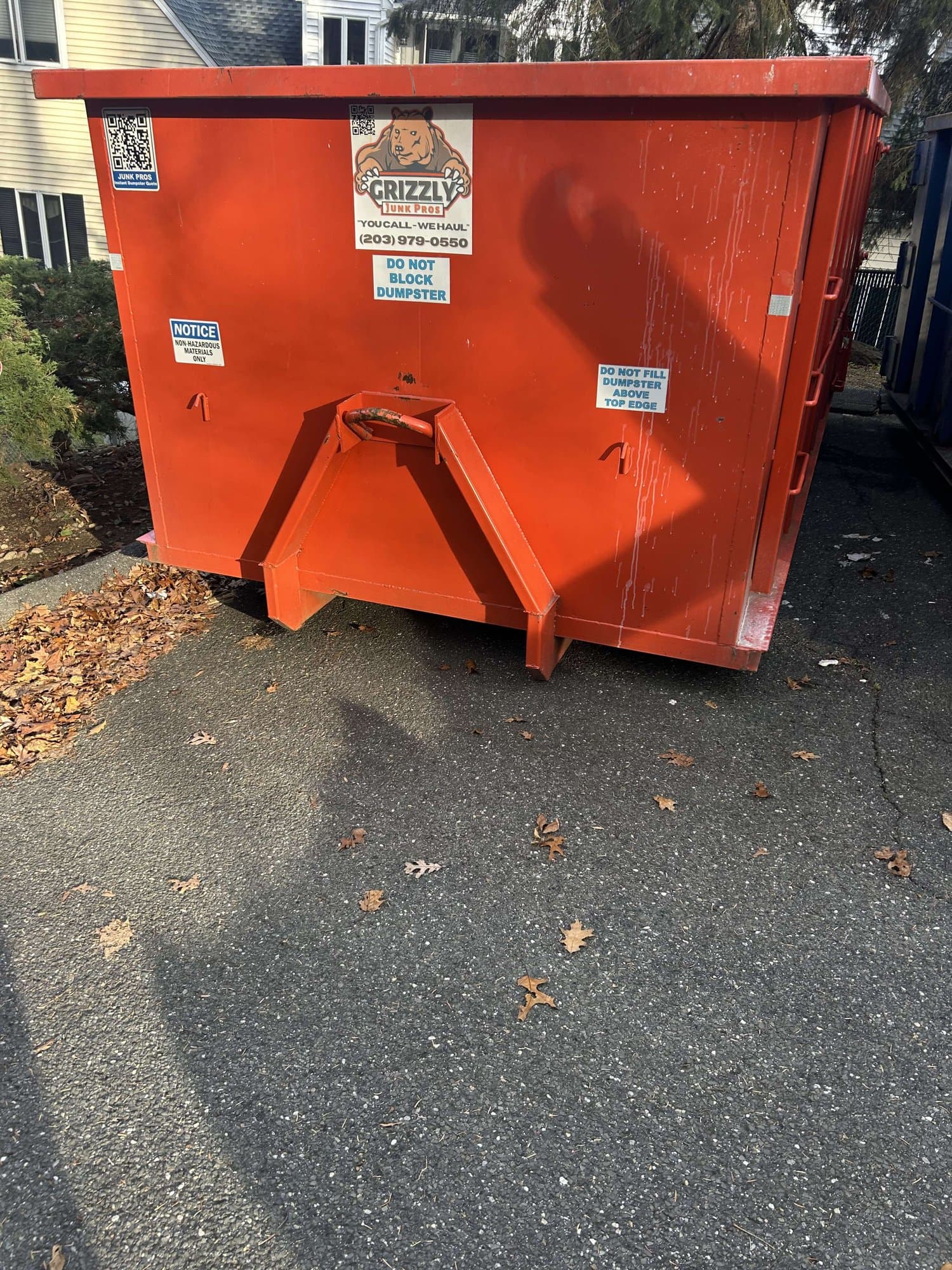 red-dumpster-placement in Wilton, CT by Stamford Junk Pros